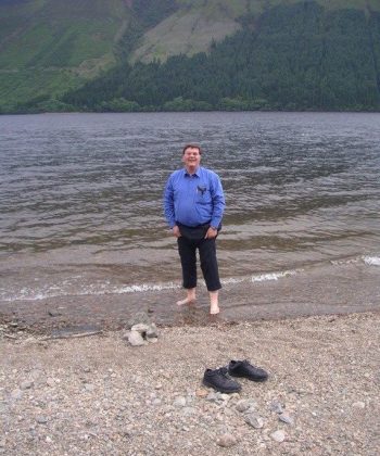 Cook standing in Loch Ness