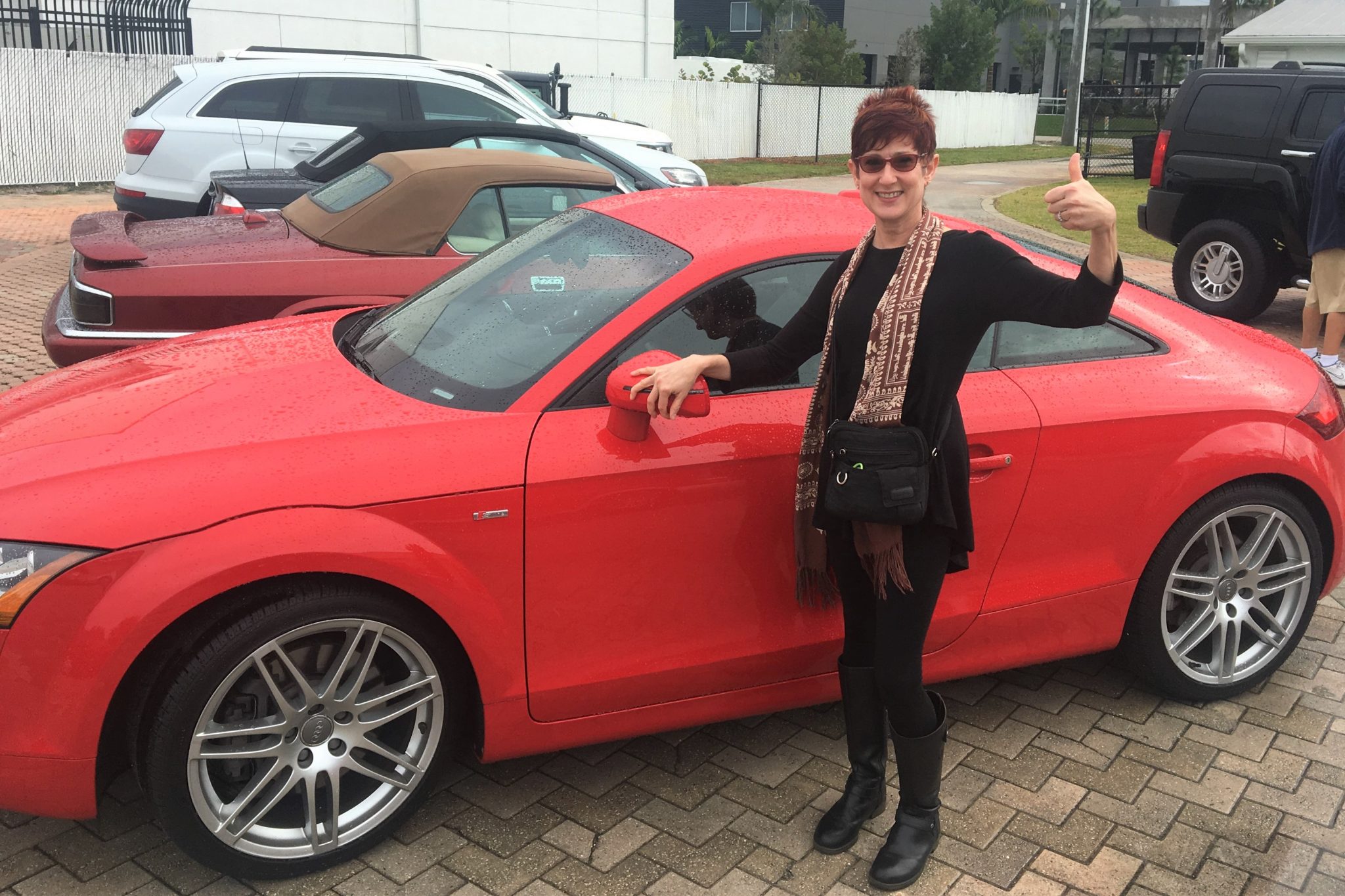 Dunzik-Gougar with her red Audi 6-speed sports car