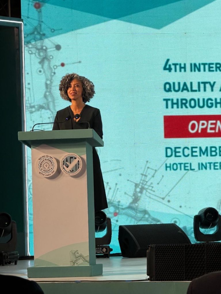 Daniela Iacona speaks at the podium about international recognition and the role in ensuring quality assurance in education.